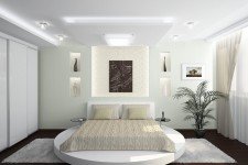   Белая спальня квартиры-студии для семьи