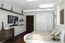   Белая кровать-подиум спальни квартиры-студии